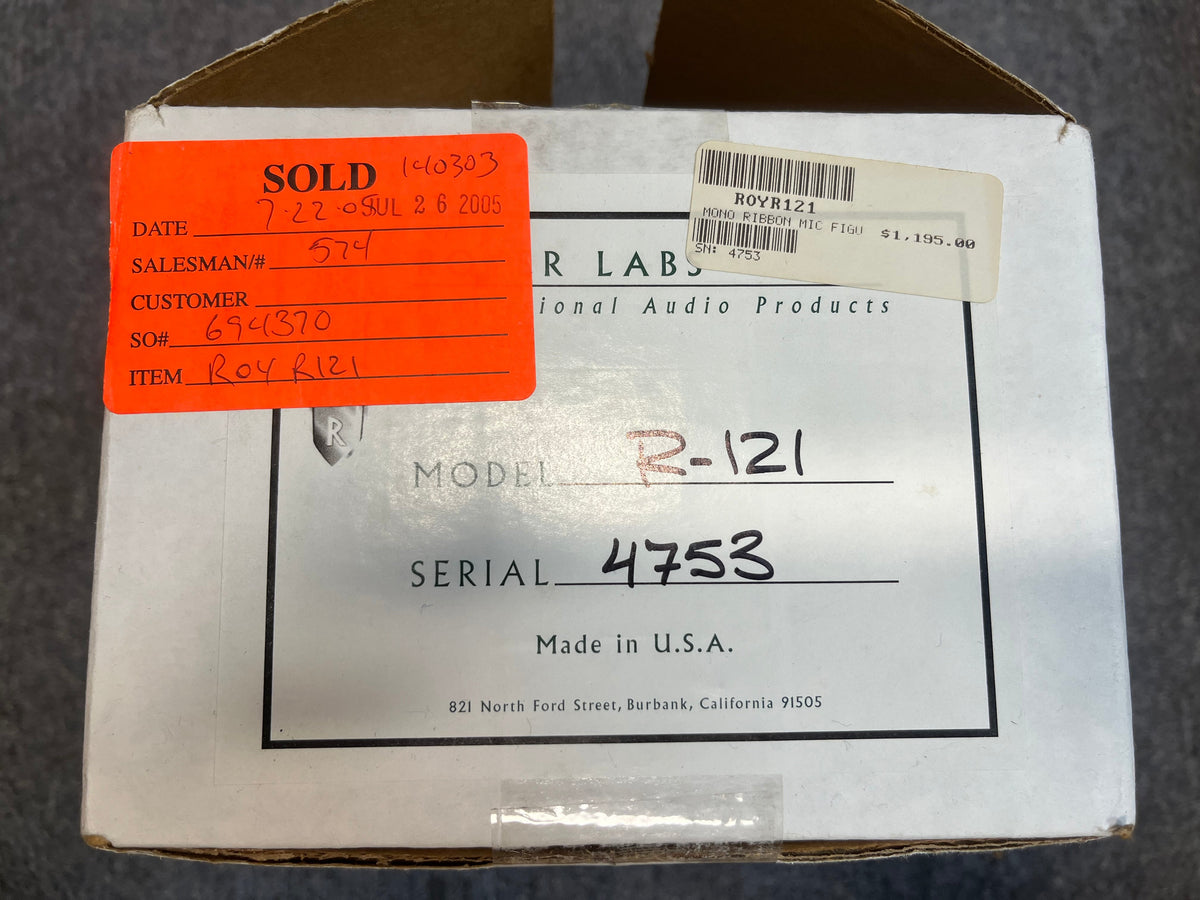 A white box labeled "ROYER LABS" contains a pre-owned Royer Labs R-121 Ribbon Microphone in excellent condition, with studio sales stickers and a red "SOLD" label dated 2005.