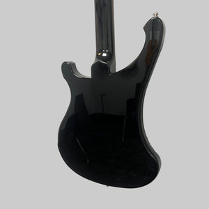 A Rickenbacker 4003 Bass Guitar – 2020 Jetglo w/Case by Rickenbacker is hanging on a white wall, photographed from the back to showcase its glossy black finish and the reflections of the room.