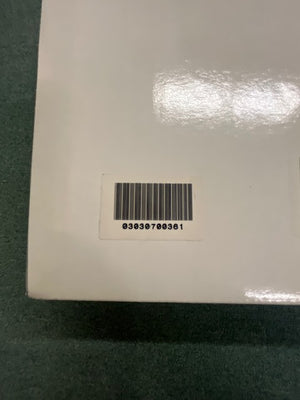 A close-up of a barcode sticker on a white surface, displaying the number 03030700361 below the barcode—identifying a Monster Power PRO 7000 Professional Reference PowerSource by Monster Power.
