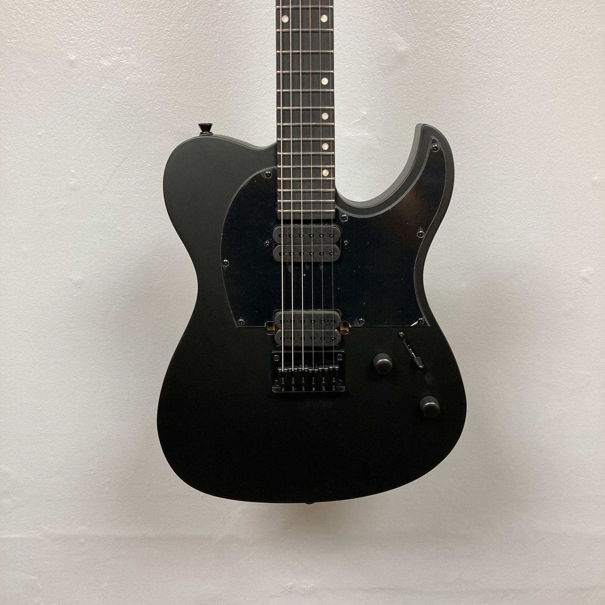 Spira T-400 MBK Electric Guitar - Black, featuring a single cutaway body, dual humbuckers, fixed bridge, and sleek design perfect for high-gain settings.