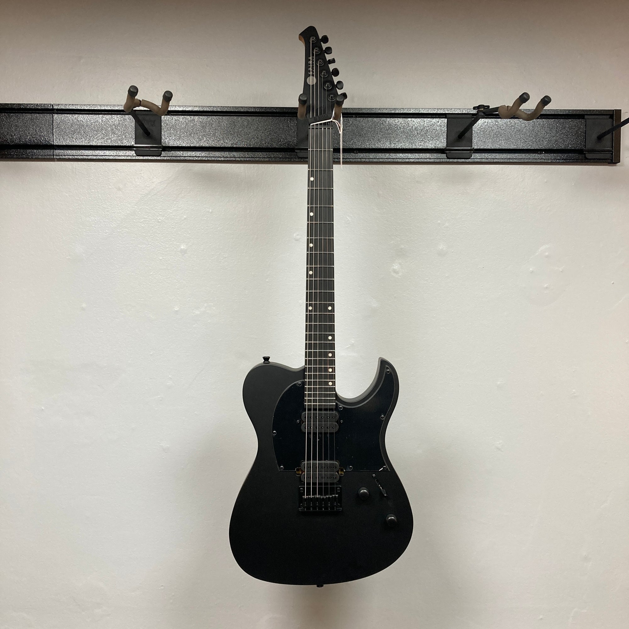 Spira T-400 MBK Electric Guitar - Black, featuring a single cutaway body, dual humbuckers, fixed bridge, and sleek design perfect for high-gain settings.