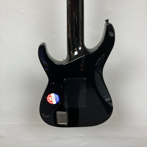 Back view of an ESP E-II Horizon FR-7 Black w/Case 7-string electric guitar by ESP, featuring two rectangular panels and a round inspection sticker on the lower left, hanging against a white wall.
