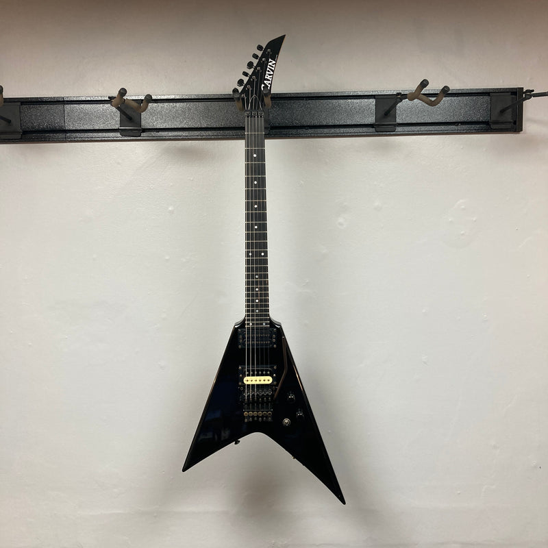 Black 1992 Carvin Ultra V USA guitar with Kahler Steeler tremolo, MJ-wound Seymour Duncan DCJ humbuckers, and control knobs, photographed against a plain light-colored wall.