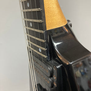 Close-up view of a Carvin 1992 Ultra V USA electric guitar neck and body, featuring strings, frets, and pickups with a Kahler Steeler Trem and MJ-wound Seymour Duncan DCJ.