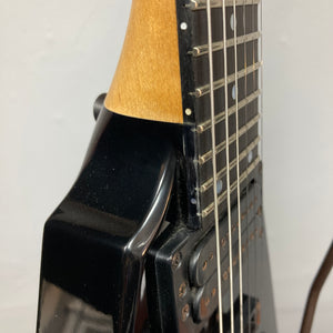 Close-up of a 1992 Carvin Ultra V USA electric guitar, featuring the neck joint, strings, and part of the fretboard. Shown with a Kahler Steeler Trem and MJ‑wound Seymour Duncan DCJ pickups against a plain background.