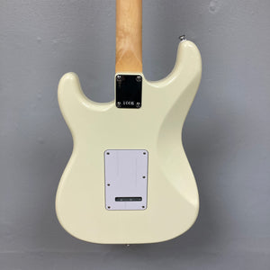 Back view of a Fender Standard Stratocaster Olympic White Refurb guitar by Fender, showing its maple neck, metal neck plate, and rectangular plastic electronics cover.