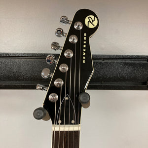Close-up of the Reverend Greg Koch Signature Gristle 90 3-Tone Burst headstock with six tuning pegs, strings, and Reverend logo on black background; includes gigbag.