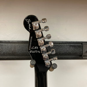 Close-up of the back of a Reverend Greg Koch Signature Gristle 90 headstock in 3-Tone Burst, showing six tuning pegs, a signature, and the markings "CR2 #60596" in white.