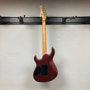 A Cort FW-G300 PRO Vivid Burgundy electric guitar is displayed on a black wall rack, photographed from the back against a plain white wall.