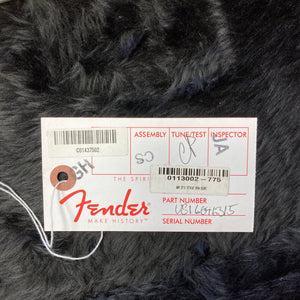 Fender inspection tag featuring barcodes, handwritten markings, and part/serial numbers, displayed on black faux fur—originally paired with a Fender American Standard Strat upgraded Gilmour EMG DC-20 in Bordeaux Metallic.