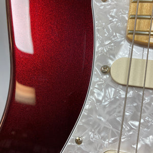 Close-up of a Fender American Standard Strat in Bordeaux Metallic, featuring a white pearloid pickguard, gold hardware, part of the neck, and upgraded EMG DG20 David Gilmour pickups.