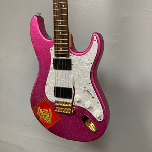 An Edwards ESP E-SN-185-TO Takayoshi Ohmura electric guitar in Twinkle Pink, featuring dual humbucker pickups, a white pickguard, gold hardware, and a red envelope with a gold Chinese character attached to the body.
