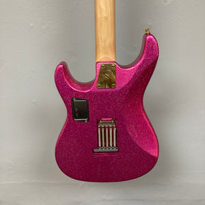 A close-up view of the back of an Edwards ESP E-SN-185-TO Takayoshi Ohmura Twinkle Pink electric guitar, featuring dual humbuckers, a maple neck, metal hardware, and a rectangular battery compartment, set against a plain light gray background.