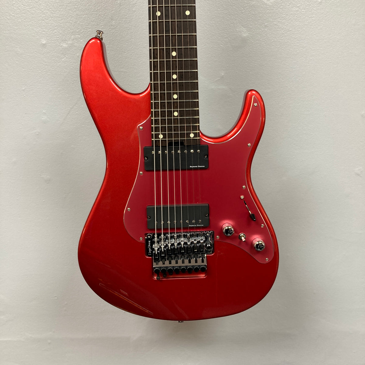 An ESP Snapper Raiden 8 ISAO Custom w/Gigbag eight-string guitar by ESP, featuring two humbucker pickups, a Floyd Rose tremolo bridge, black knobs, and a dark fretboard, photographed against a plain light-colored wall.