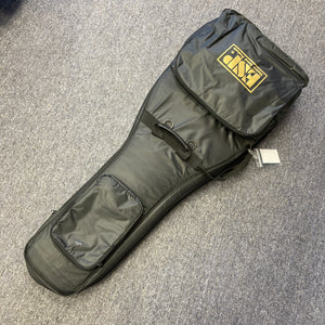 A black padded gig bag, featuring two exterior pockets and a yellow ESP logo, designed for the ESP Snapper Raiden 8 ISAO Custom guitar, rests on a gray carpeted floor.