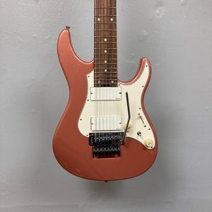 An Edwards E-SN7-194MF Mikio Fujioka Signature Burgundy Mist electric guitar with white pickups, a white pickguard, a whammy bar, and a rosewood fretboard, hanging against a light gray wall. This eye-catching seven-string guitar from Edwards is modeled after the Mikio Fujioka Signature 7-String model.