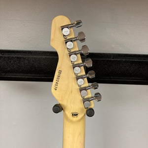 The back of a guitar headstock displaying six metal tuning pegs, a serial number, and a “Fender Special Edition” stamp on light-colored wood evokes the meticulous craftsmanship found in signature instruments such as the Edwards E-SN7-194MF Mikio Fujioka Signature Burgundy Mist w/Case by Edwards.