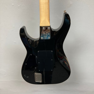 The back of a 2019 ESP USA M-II Purple Haze Burst electric guitar, featuring a natural wood neck and an “ESP” label on the metal neck plate, is displayed against a plain light background. Crafted in the USA by ESP, this guitar highlights superior craftsmanship and striking style.