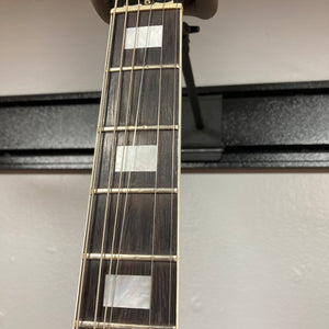 Close-up view of a guitar neck showing three rectangular mother-of-pearl inlays on a dark wood fretboard against a plain background, characteristic of the 1977 Gibson SG Standard Cherry w/Case by Gibson.