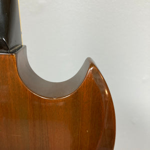 Close-up of the upper body and neck joint of a Gibson 1978 EDS-1275 Double Neck Walnut guitar with case, shown against a plain light-colored background.