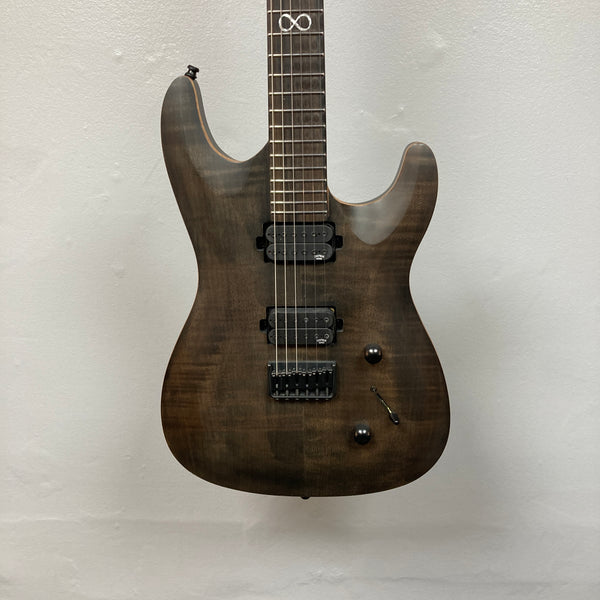 Chapman ML1 Pro Modern Lunar electric guitar by Chapman, featuring a dark wood finish, dual humbucker pickups, 24-fret neck, two control knobs, and a switch, photographed against a plain white wall.
