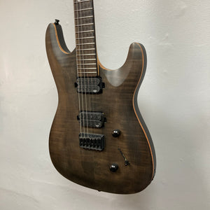 Chapman ML1 Pro Modern Lunar electric guitar by Chapman, featuring a dark wood finish, dual humbucker pickups, two control knobs, and a selector switch, hangs against a plain light-colored wall. This modern guitar also offers a sleek 24-fret fingerboard for extended playability, and comes with a case.