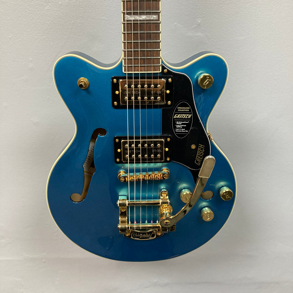 A Gretsch G2655TG Streamliner Riviera Blue Refurb semi-hollow electric guitar with gold hardware, equipped with two Broad’Tron BT 3S pickups and a Bigsby tremolo tailpiece, displayed against a plain white background.