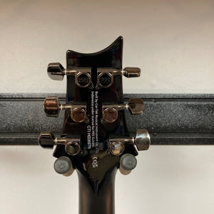 Close-up of the back of a PRS SE Mark Holcomb - Holcomb Blue Burst w/Gigbag Used Consign headstock showing six tuners, manufacturer info, and serial number.