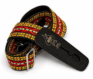 The D'Andrea Ace Pro Lock-It 2" Jacquard Guitar Strap features a vibrant red, yellow, and black pattern with a black leather end stamped "Ace" and "Made in USA," inspired by vintage Ace straps.
