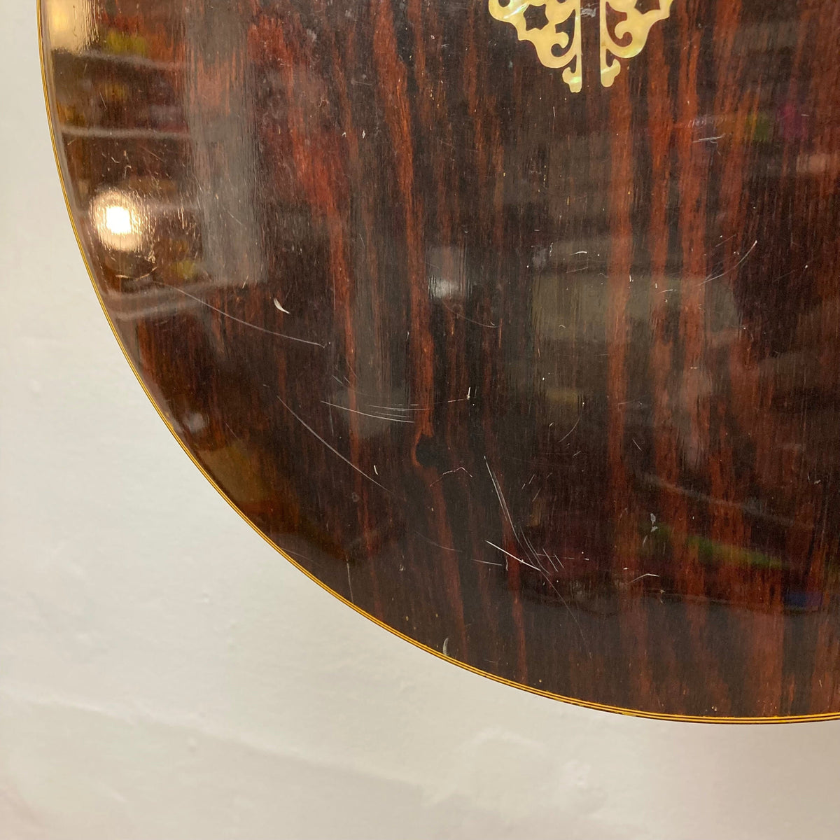 Close-up of the Alvarez Minstrel 4-string Tenor Banjo 1970s, showcasing intricate inlays and detailed wood grain on the resonator.