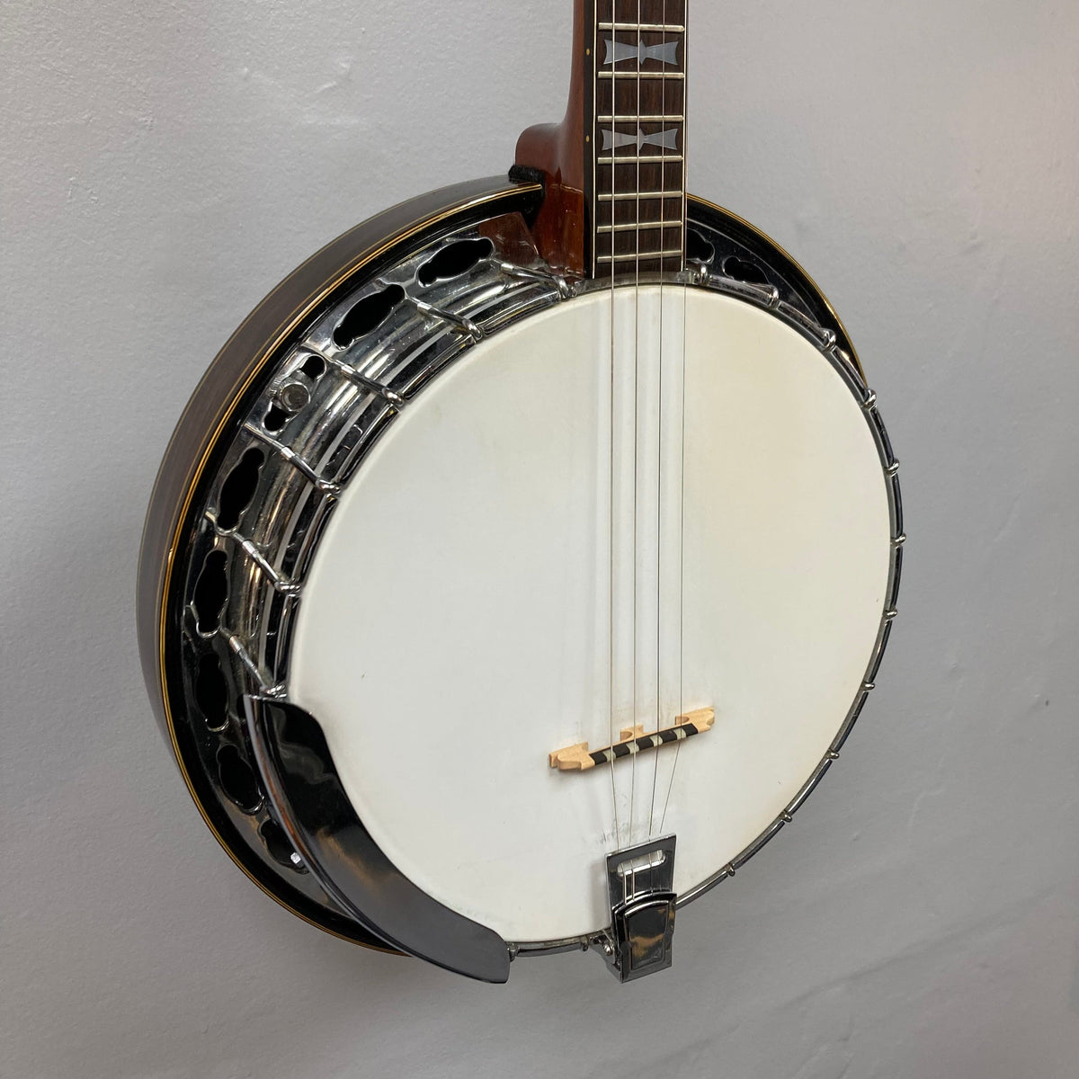 Alvarez Minstrel 4-string Tenor Banjo 1970s, featuring a mahogany neck and resonator with intricate inlays on the fretboard and headstock.