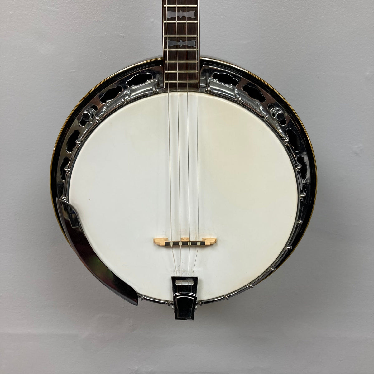 Alvarez Minstrel 4-string Tenor Banjo, 1970s model, displayed on a wall.