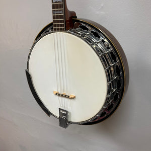 Alvarez Minstrel 4-string Tenor Banjo from the 1970s displayed on a wall, showcasing its classic design and detailed craftsmanship.