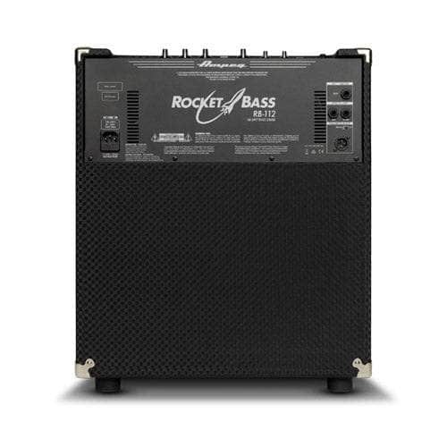 A black Ampeg RB12 Rocket Bass Amp is shown from the back, displaying its input/output panel, top-mounted control knobs, and textured covering. The model name and Ampeg branding are visible on the back panel.