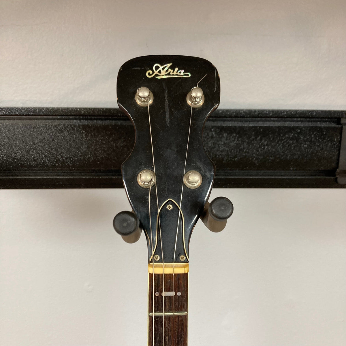 Aria Tenor Banjo 4 String 1970s w/Case, featuring a close-up of the headstock and neck, showcasing the craftsmanship and hardware details.