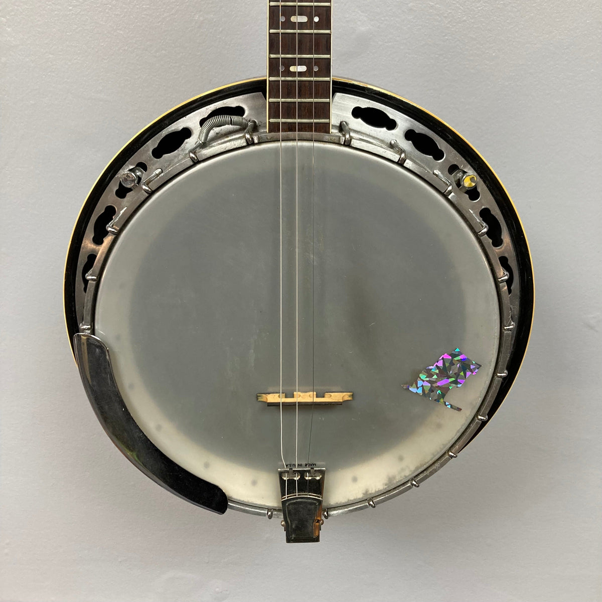 Aria Tenor Banjo 4 String 1970s, close-up view showing detailed craftsmanship, resonator, and fingerboard with mother-of-pearl markers, includes case.