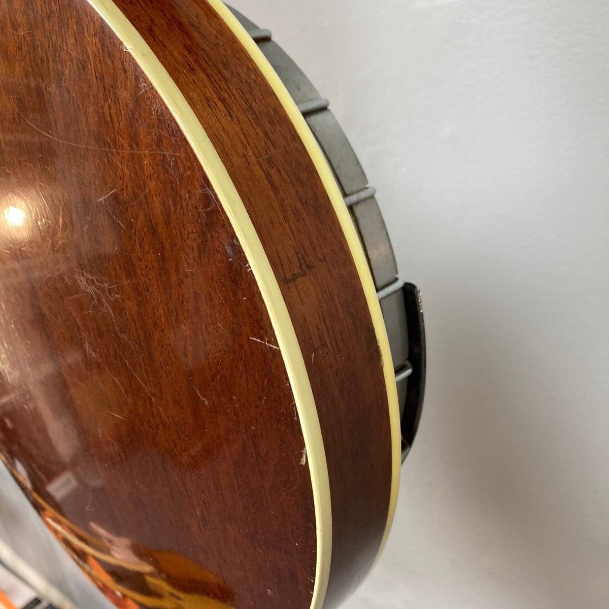 Aria Tenor Banjo 4 String 1970s, close-up of the guitar&#39;s detailed craftsmanship, highlighting the quality wood body, metal tone ring, and chrome-plated hardware.