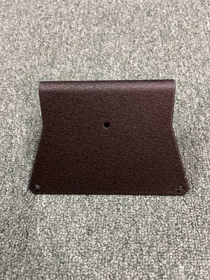 A black Aviom MT-1 Mic Stand Mount by Aviom, featuring three holes—one centered, two at the bottom corners—rests on a textured gray surface.