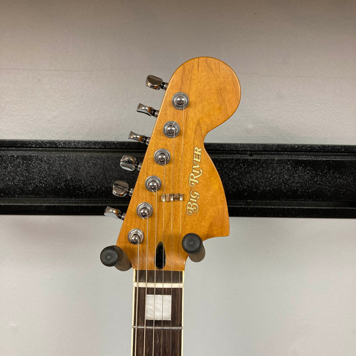 Big River Jazzcaster Custom Relic Pelham Blue Used electric guitar headstock with six chrome tuning pegs and a wooden finish.