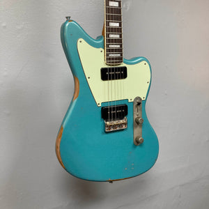 Big River Jazzcaster Custom Relic Pelham Blue electric guitar with a cream pickguard, two black Lollar pickups, and visible wear along the body edges.