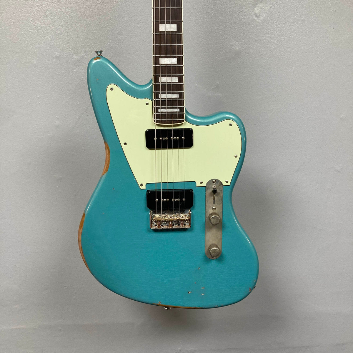 Big River Jazzcaster Custom Relic Pelham Blue electric guitar featuring an offset body, white pickguard, and two black soapbar Lollar pickups.