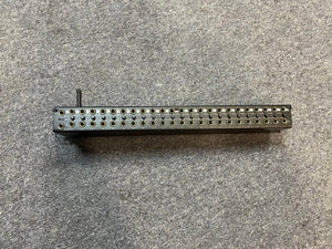 A Black Lion Audio PBR TRS-BT 46-Point Gold-Plated TRS Patchbay with Bluetooth sits on a gray carpeted surface, displaying two rows of circular jacks and a lever on the left side.