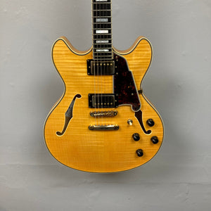 Close-up of a D'Angelico Excel DC Semi-hollowbody guitar, showcasing its strings and body details.