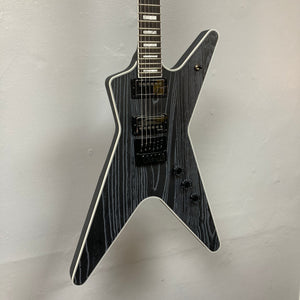 Dean Custom Run #16 ML Sandblasted Grey guitar displayed on a wall, showcasing its iconic ML design and intricate string details.