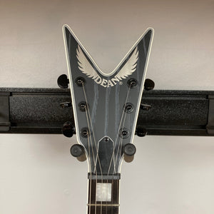 Dean Custom Run #16 ML Sandblasted Grey guitar on a stand, showcasing its iconic ML design with visible Evertune bridge and Fishman pickups.