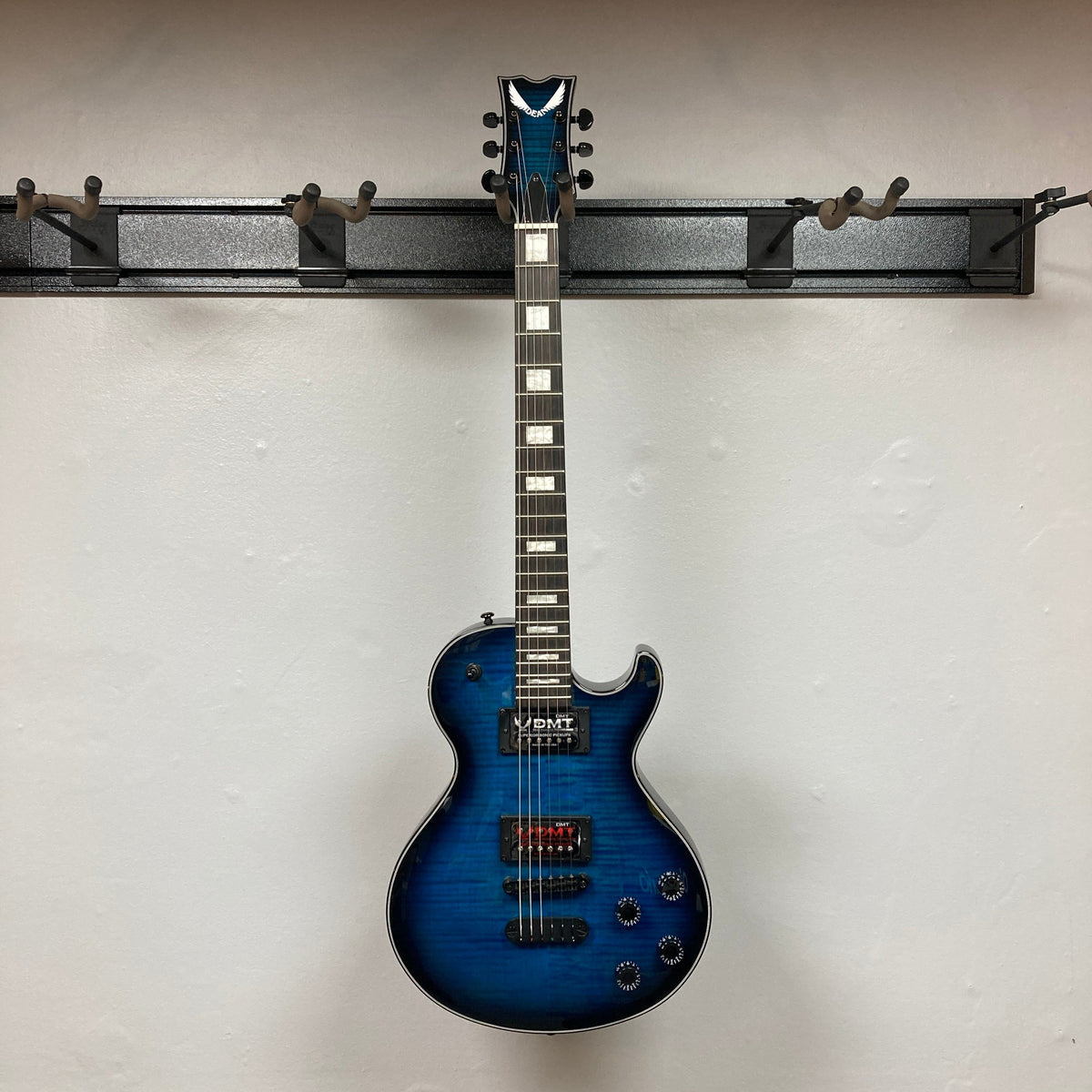 Dean Thoroughbred John Connolly Trans Blueburst electric guitar with a flame maple top, displayed on a white surface.