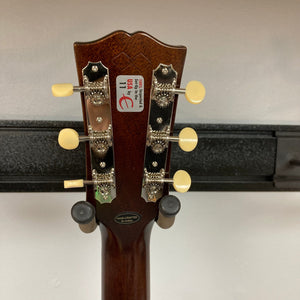 Epiphone 1942 Banner J-45 Vintage Sunburst acoustic guitar close-up, showcasing the solid mahogany back, mother-of-pearl inlays, and Gibson Custom logo on the headstock.