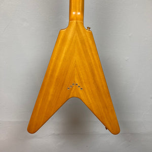 Epiphone 1958 Korina Flying V guitar close-up, showcasing gold hardware and screws, with a solid Korina body and neck.