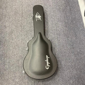 Epiphone Dave Grohl DG-335 guitar case on carpet, showcasing the protective hard case for the iconic instrument available at Guitars on Main.