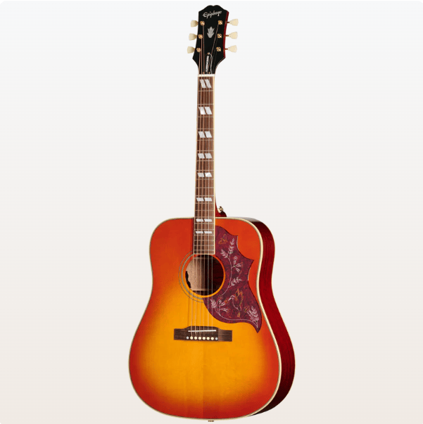 The Epiphone Hummingbird Standard Cherry Sunburst is a six-string acoustic-electric guitar with a decorative pickguard and pearl fretboard inlays.
